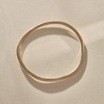 Rustic Bangle Bracelet in recycled bronze, a single organic hand-polished bangle.