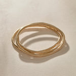 Set of 3 Rustic Bangles in gold from above, the three organic bands overlapping.