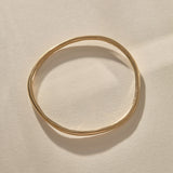 Rustic Bangle Bracelet in solid recycled gold, a single organic hand-polished bangle.