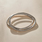 Set of 3 Rustic Bangles in sterling silver stacked together.
