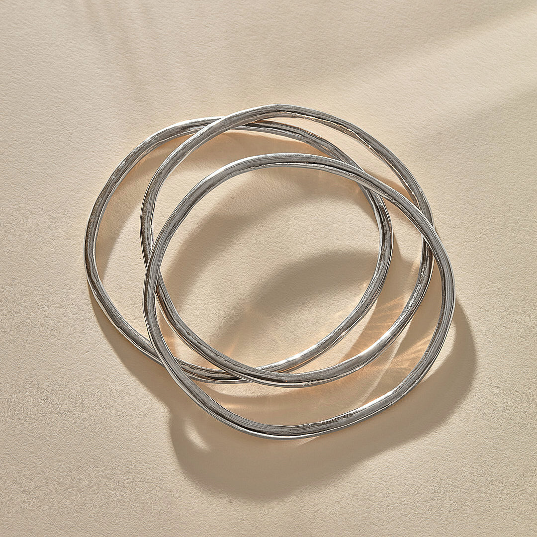 Set of 3 Rustic Bangles in recycled sterling silver, three organic bands overlapping.