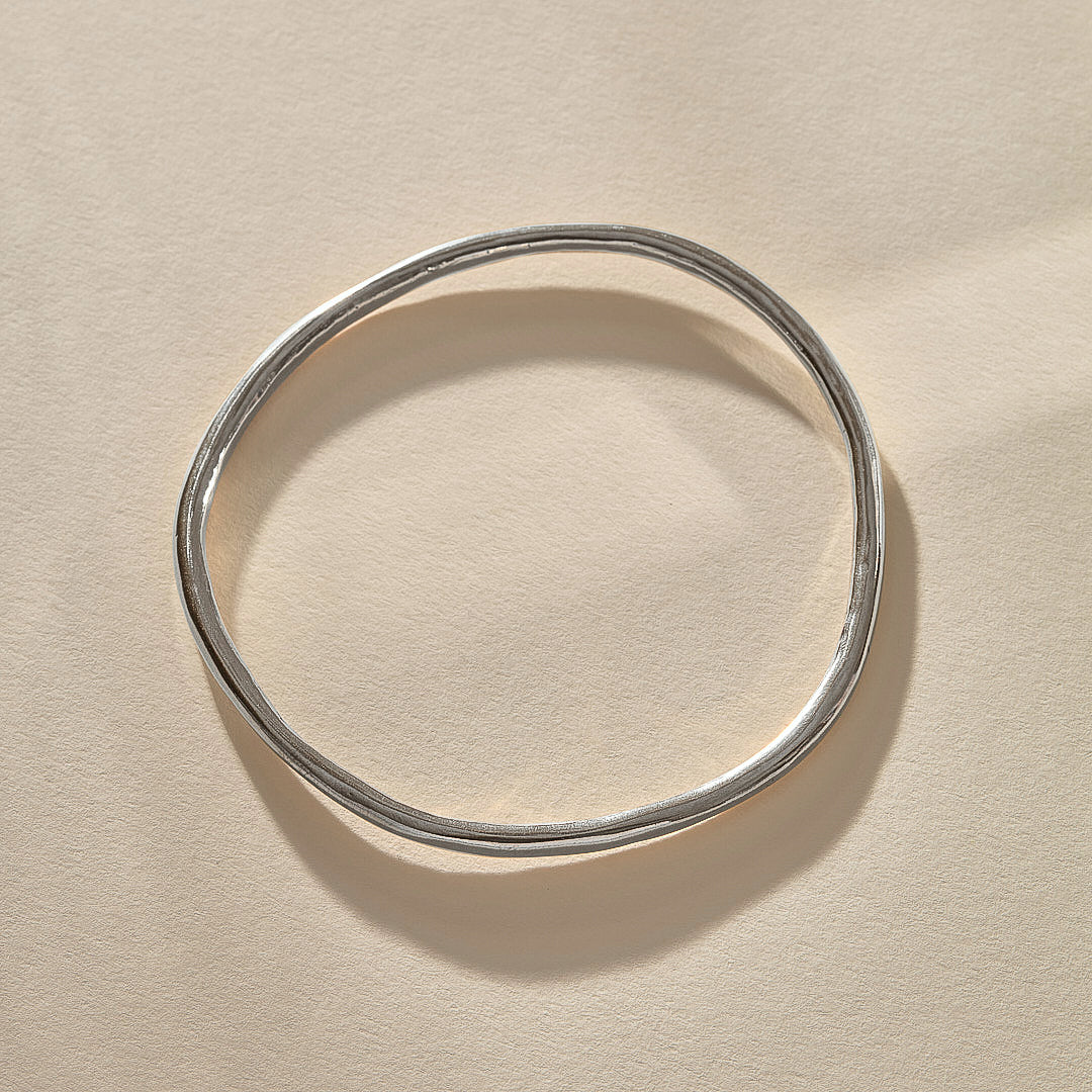 Rustic Bangle Bracelet in recycled sterling silver, a single organic hand-polished bangle.