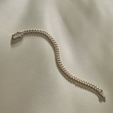 Sagrado Cuban Link Bracelet in sterling silver laid flat, showing the full length of the curb chain.