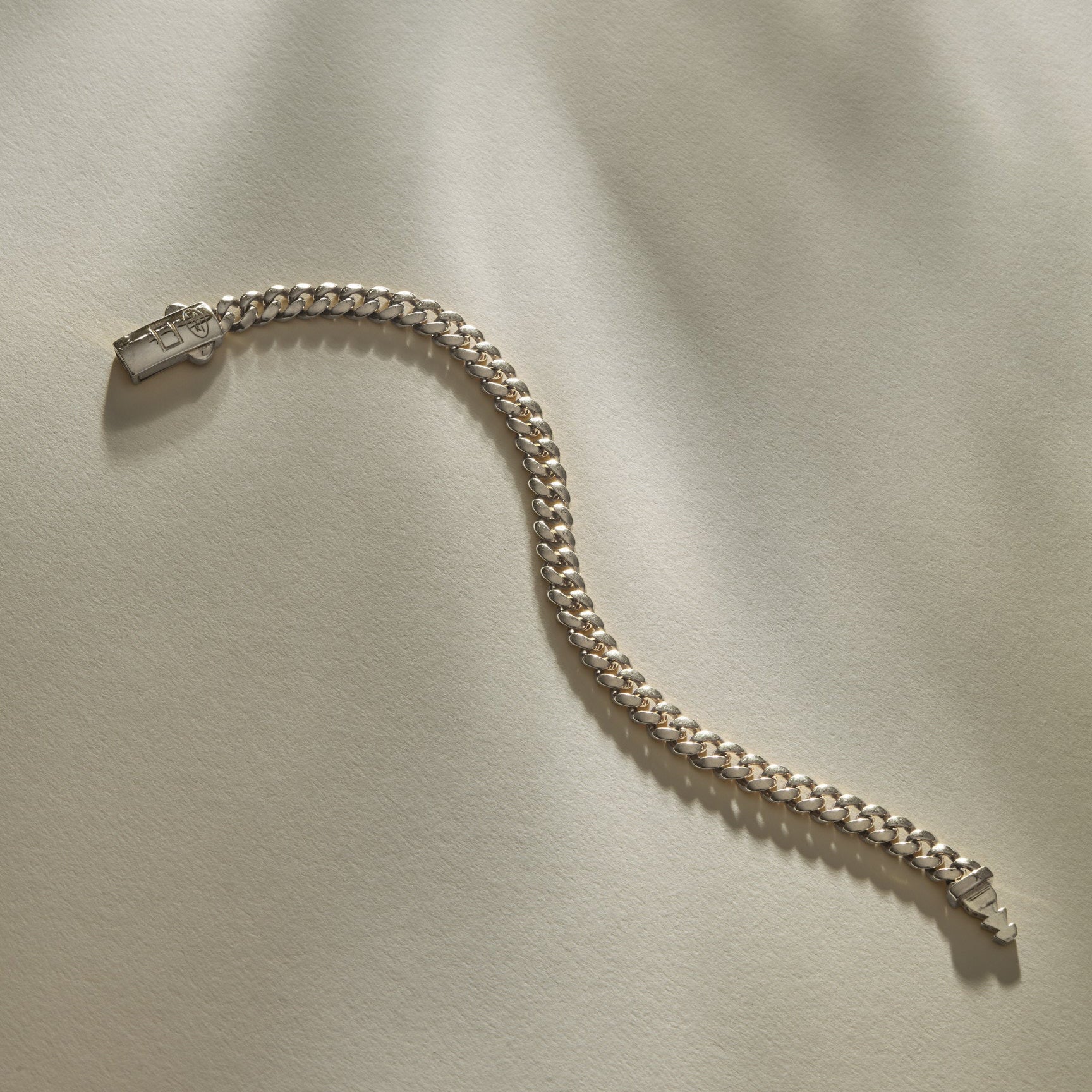 Sagrado Cuban Link Bracelet in sterling silver laid flat, showing the full length of the curb chain.