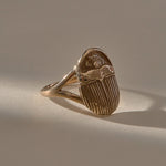 Scarab Ring in recycled bronze, low angle view of the carved scarab beetle