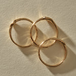 The Selkie Stack V rings from above, showing their hand-formed 10k gold bands.