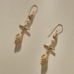 Sereia Shell and Pearl Chandelier Earrings in solid recycled gold, a pearl and cast spiral seashell drop on gold hooks.