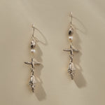 Sereia Shell and Pearl Chandelier Earrings in recycled sterling silver, a pearl and cast spiral seashell drop on silver hooks.