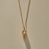 Sereia Spiral Shell Necklace in recycled bronze, a cast spiral seashell pendant on a fine rolo chain.
