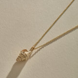 Sereia Spiral Shell Necklace in solid recycled gold, a cast spiral seashell pendant on a fine rolo chain.