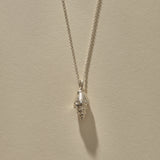 Sereia Spiral Shell Necklace in sterling silver, a close view of the ridged spiral shell.