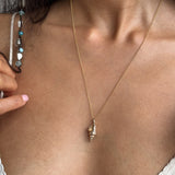 Sereia Spiral Shell Necklace worn close at the neck, the spiral shell resting at mid-chest.