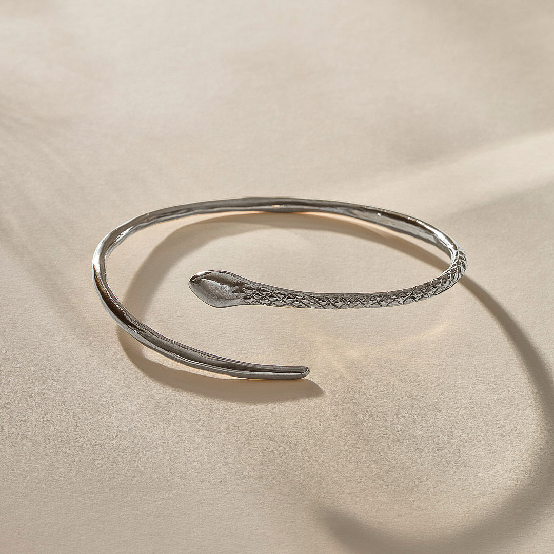 Serpent Snake Arm Cuff in recycled sterling silver, hand-carved with a detailed snake head and scales.