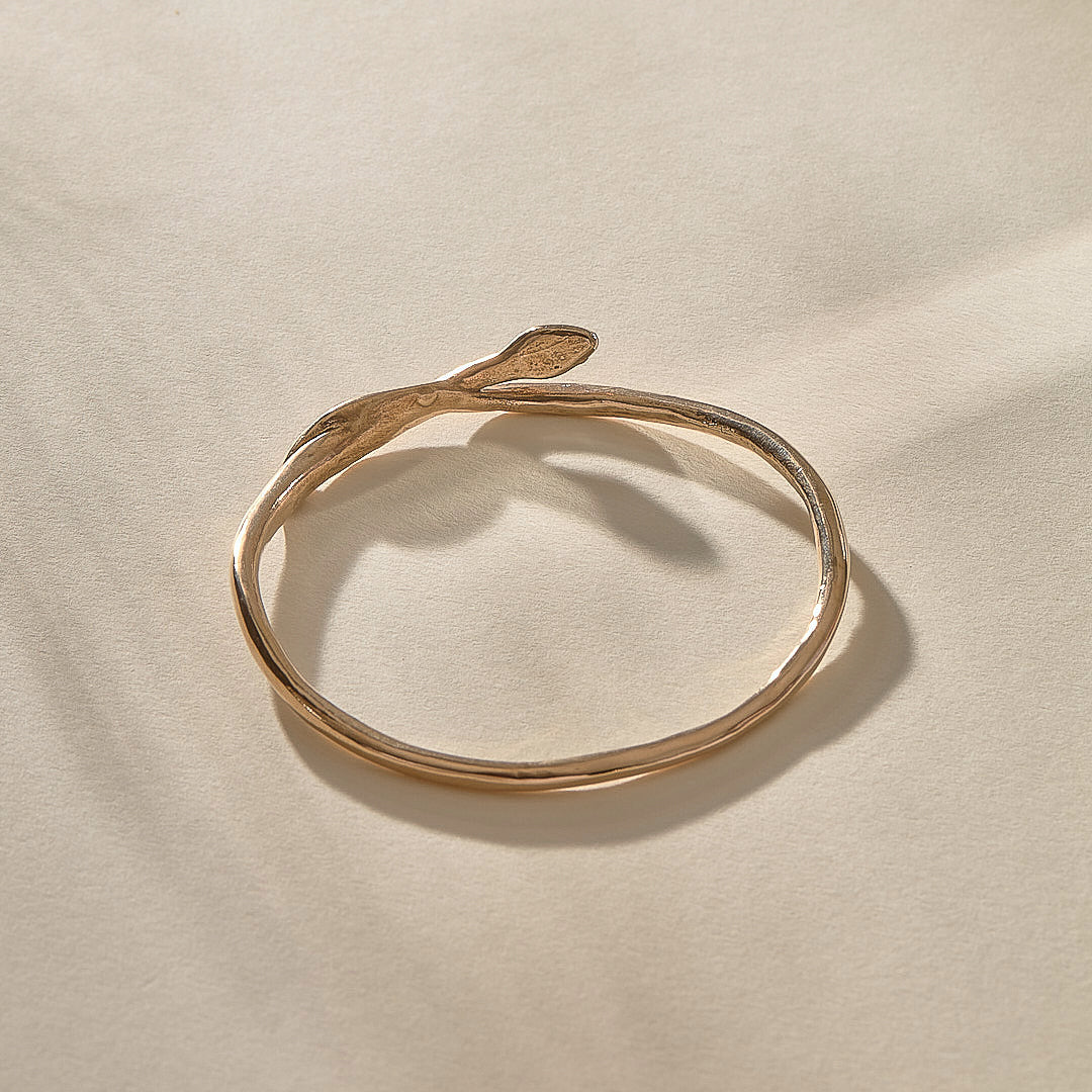Serpent Snake Bangle in bronze with the snake head raised.