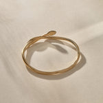 Serpent Snake Bangle in gold with the snake head raised.