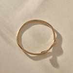 Serpent Snake Bangle in gold from above, showing its full round shape.