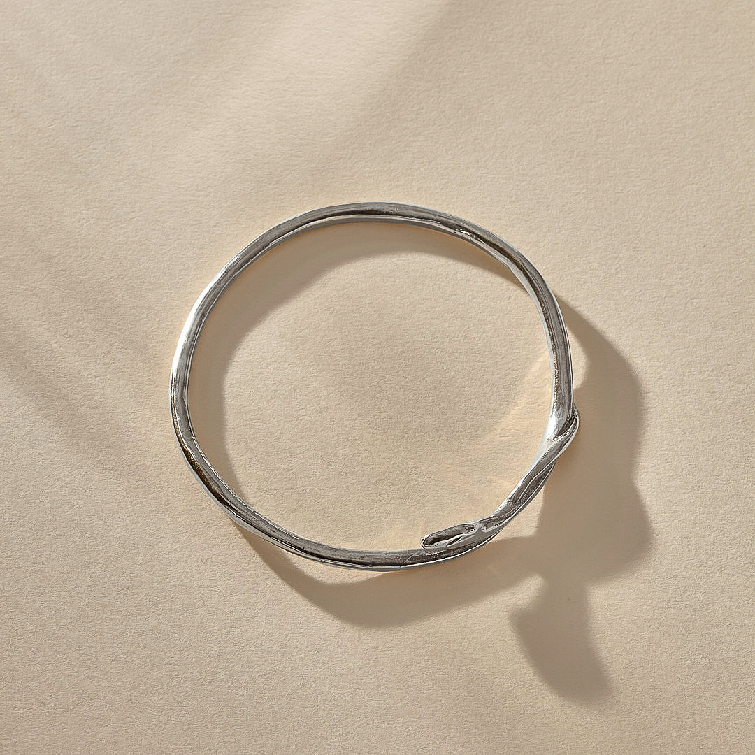 Serpent Snake Bangle in sterling silver from above, showing its full round shape.
