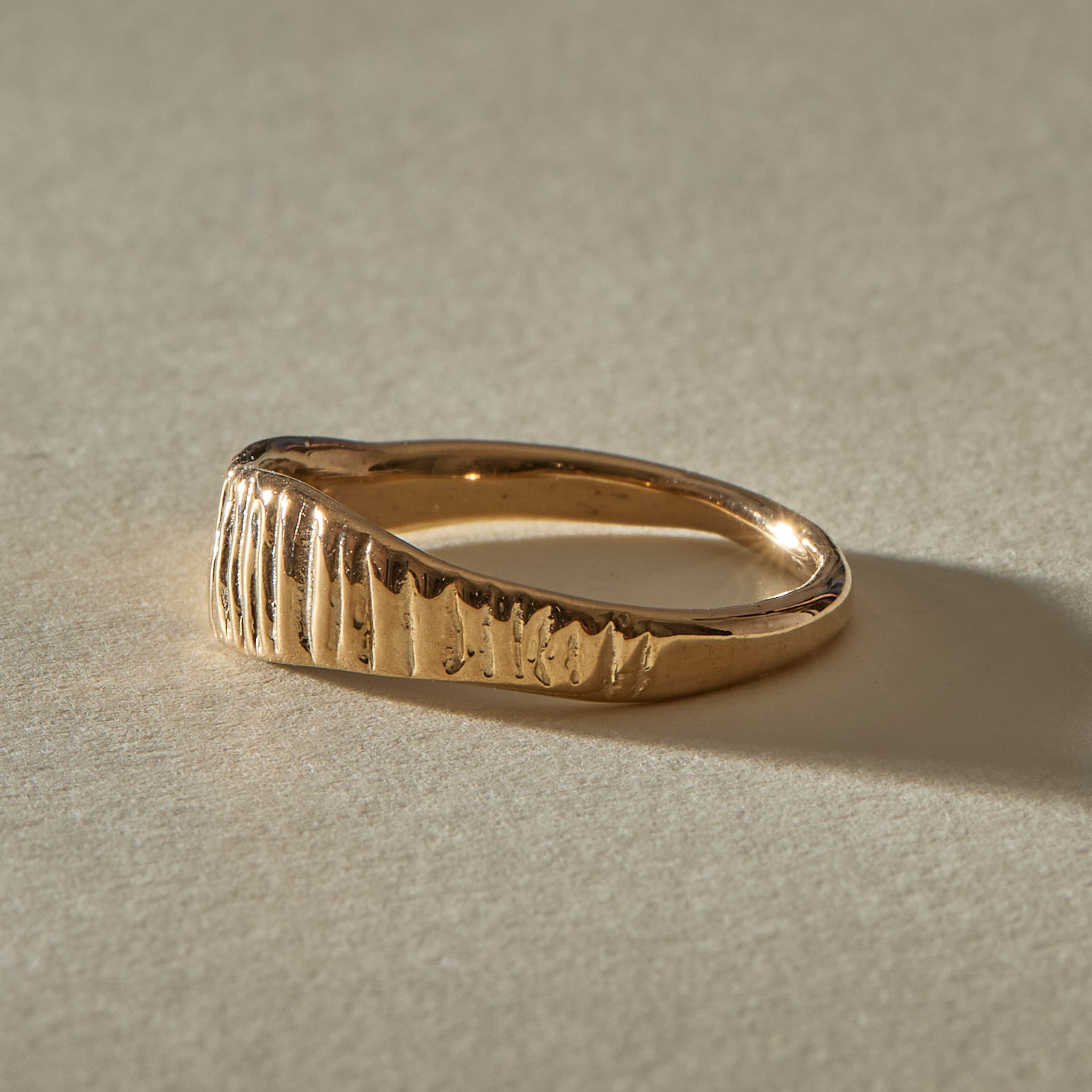 Smoke Ring in solid recycled gold, organic band carved with vertical smoke lines