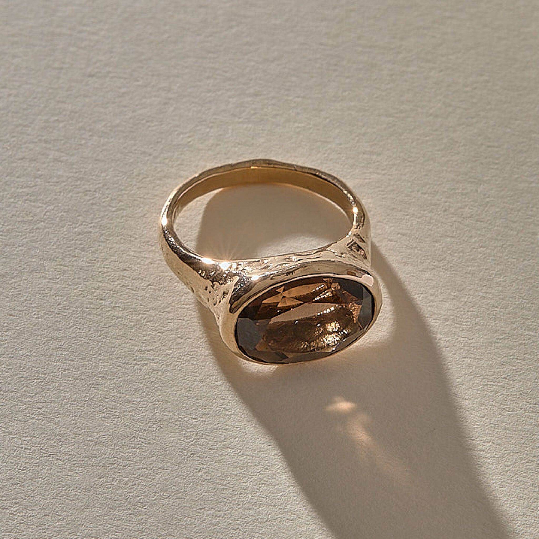 Smoky Quartz Signet Ring in recycled bronze, view from above of the oval smoky quartz