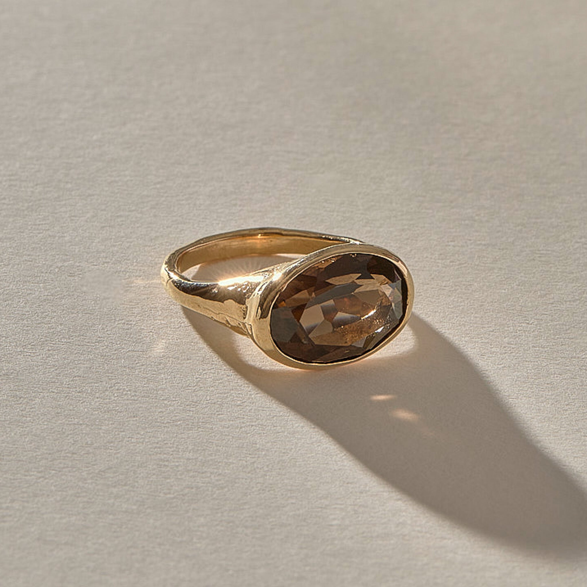 Smoky Quartz Signet Ring in solid recycled gold, low angle view of the oval stone