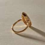 Back of the Solaria Ring, showing the soft gold bezel holding the pear cut heliodor.
