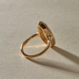 Back of the Solaria Ring, showing the soft gold bezel holding the pear cut heliodor.