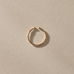 Solea Toe Ring in solid recycled gold, angled view in soft light