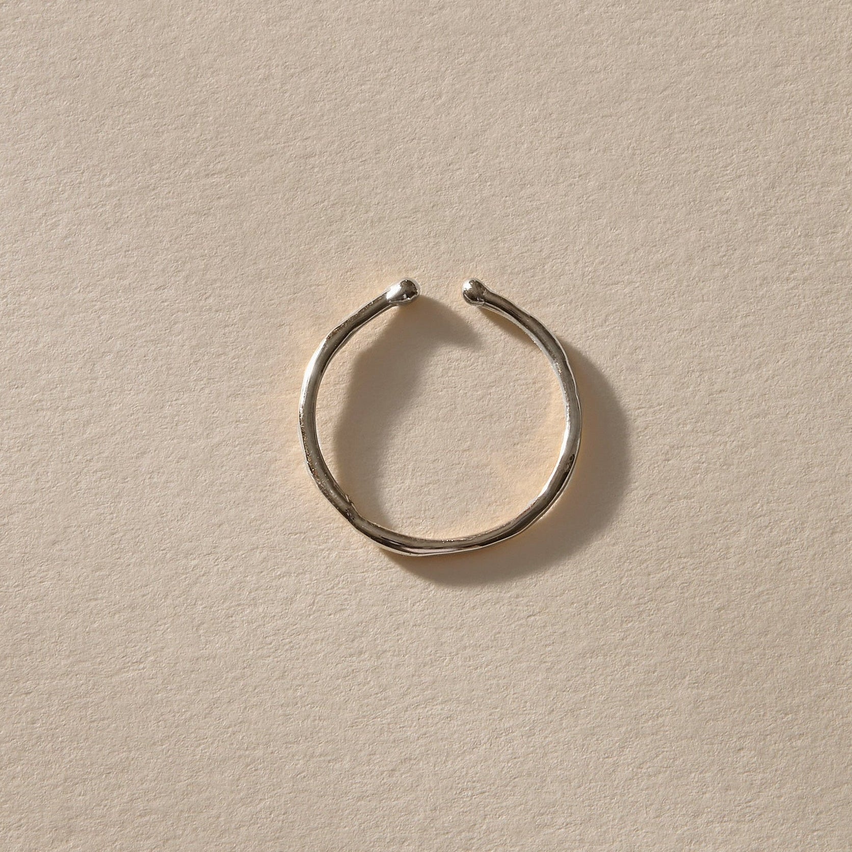 Solea Toe Ring in recycled sterling silver, angled view showing the adjustable opening