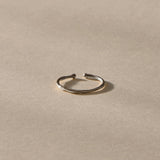 Solea Toe Ring in recycled sterling silver, side view of the delicate band