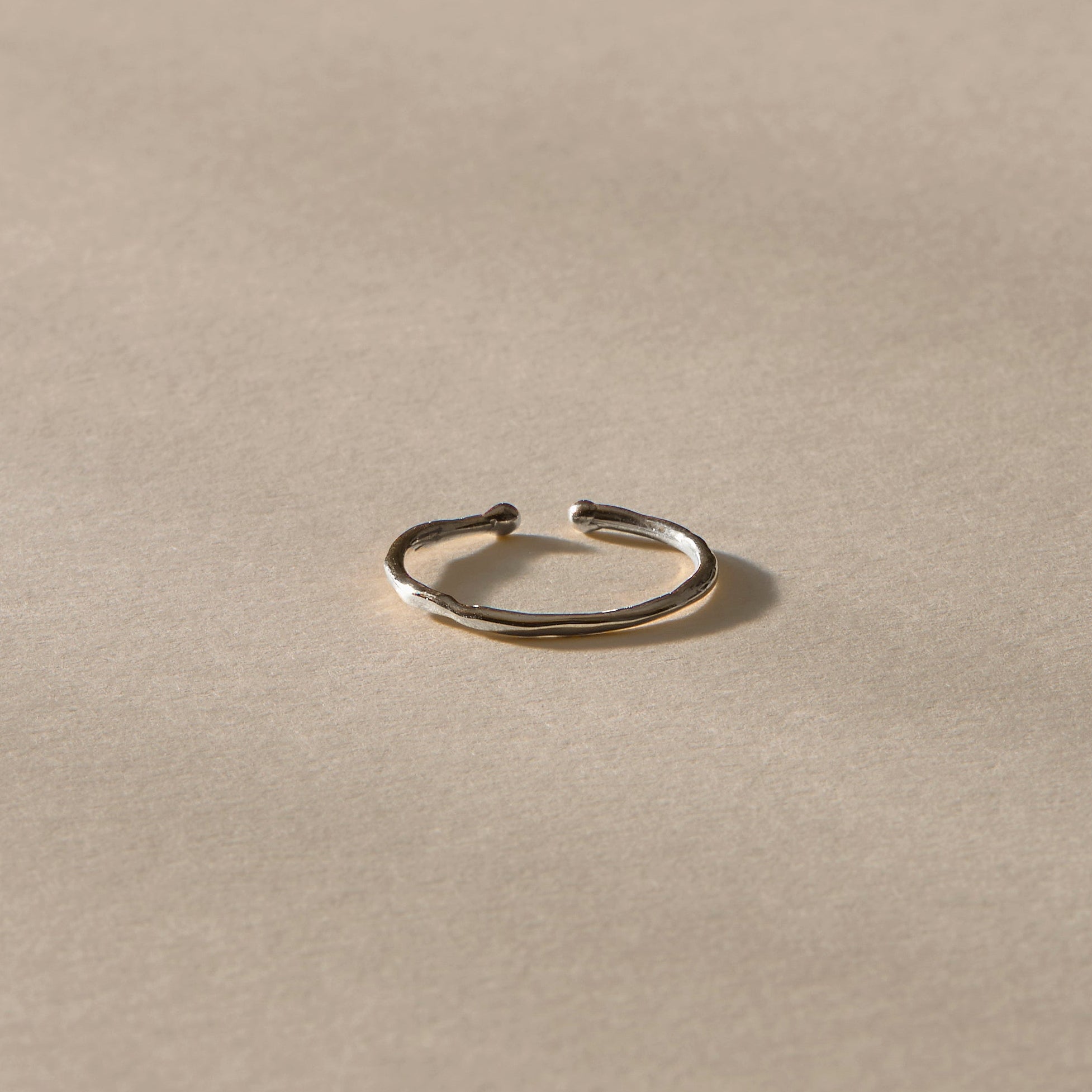 Solea Toe Ring in recycled sterling silver, side view of the delicate band