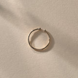 Solea Toe Ring in recycled sterling silver, view from above in soft light