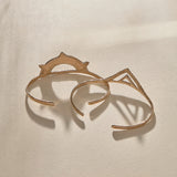 Sunkeeper and Pyramids cuffs in bronze from above, the sun and pyramid faces side by side.
