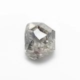 The 2.52ct polished raw salt and pepper diamond from the Vía Láctea I ring, shown loose on a white background.