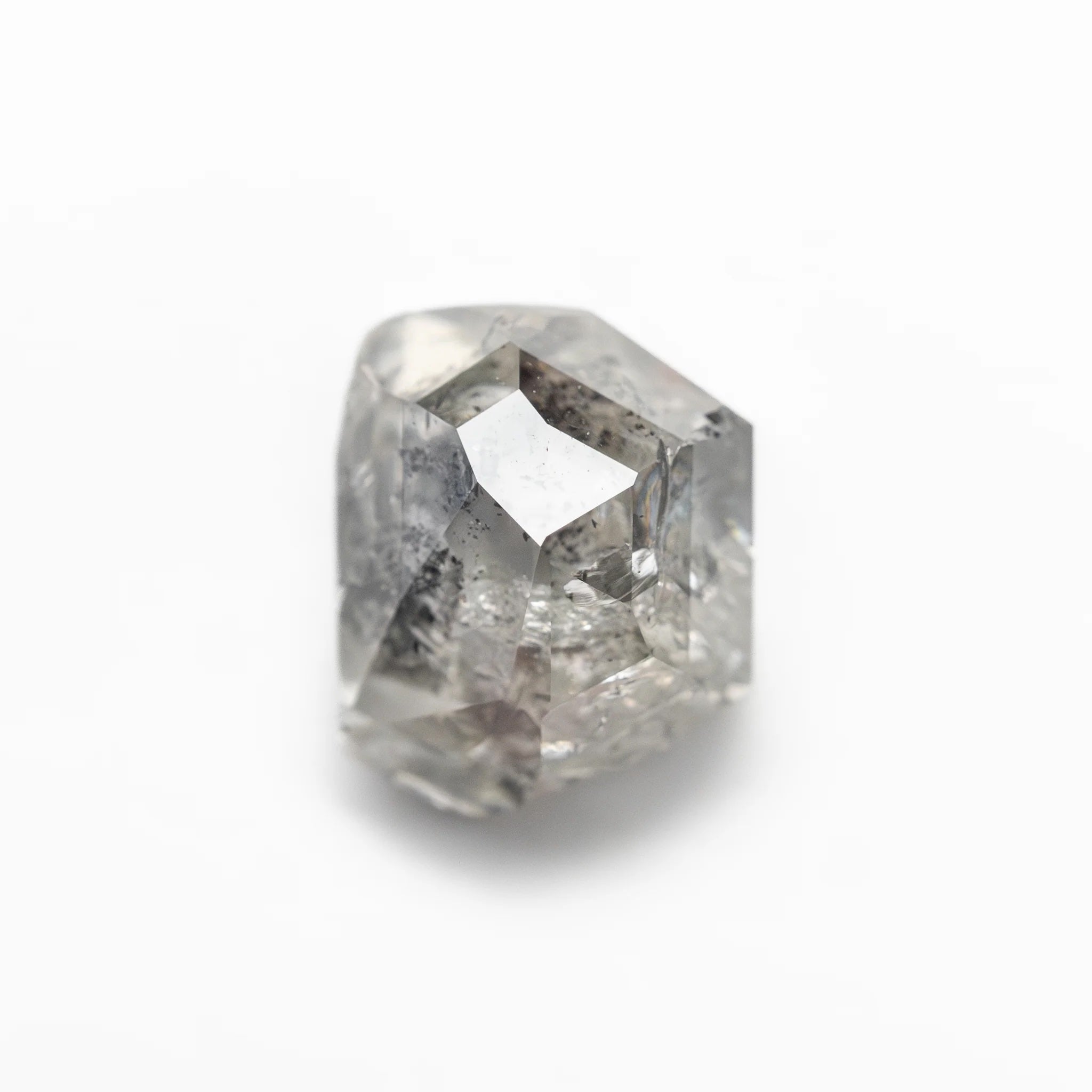 The 2.52ct polished raw salt and pepper diamond from the Vía Láctea I ring, shown loose on a white background.