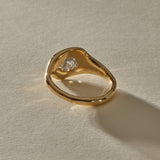 Back of the Vía Láctea I ring, showing the gold setting beneath the raw diamond and the polished band.