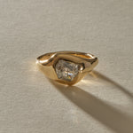 Vía Láctea I ring from the front, showing the galaxy-like inclusions of the raw salt and pepper diamond in its sculptural gold setting.