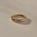 Wabi Ring in recycled bronze, angled view of the softly undulating band