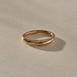 Wabi Ring in recycled bronze, angled view of the softly undulating band