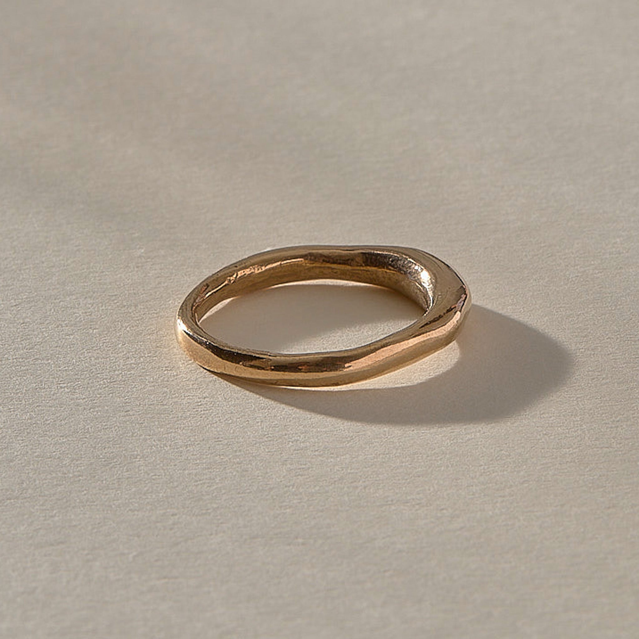 Wabi Ring in recycled bronze, side view of the band tapering from 4mm to 2mm