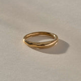 Wabi Ring in solid recycled gold, angled view of the softly undulating band