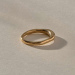 Wabi Ring in solid recycled gold, side view of the band tapering from 4mm to 2mm