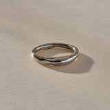 Wabi Ring in recycled sterling silver, angled view of the softly undulating band
