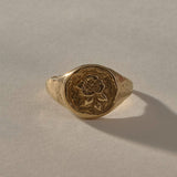 Wild Rose Ring in solid recycled gold, front view of the rose signet face