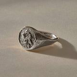 Wild Rose Ring in recycled sterling silver, angled view of the rose signet face