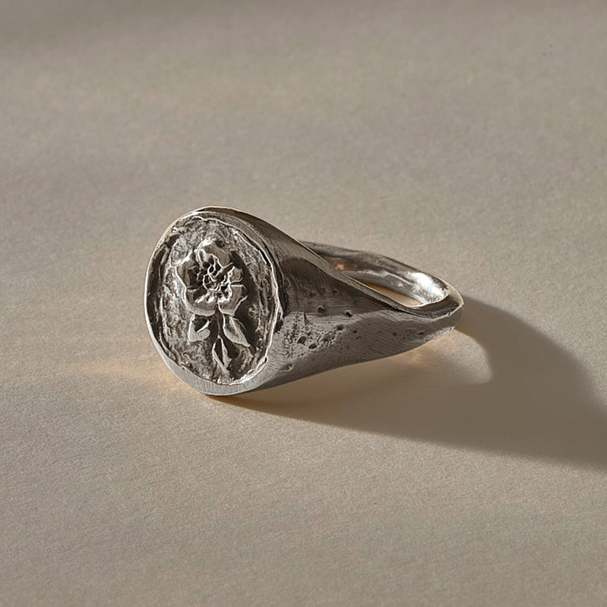 Wild Rose Ring in recycled sterling silver, angled view of the rose signet face