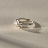 Yemayá Pearl Ring in silver at an angle, showing the wave-like texture around the pearl.