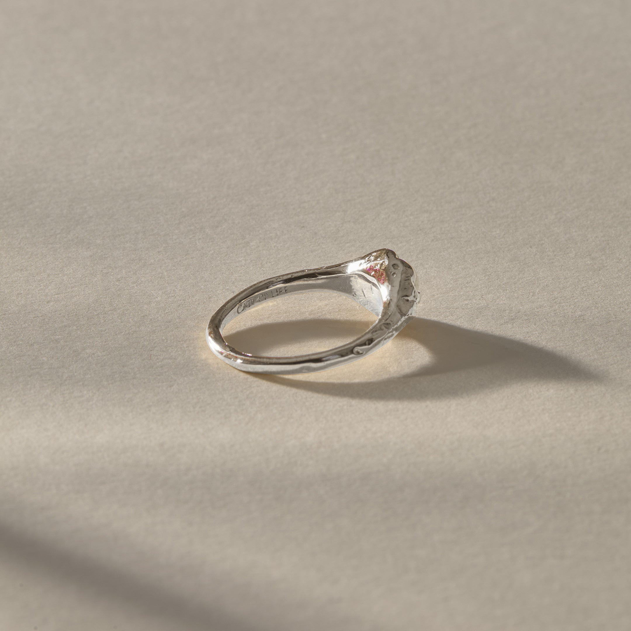 Yemayá Pearl Ring in sterling silver from the side, with the pearl rising from the textured setting.