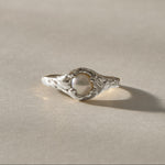Yemayá Pearl Ring in recycled sterling silver, a white freshwater pearl crowning an organic, ocean-worn band.