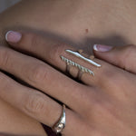 Hand wearing the Akash Shield Statement Ring in sterling silver.