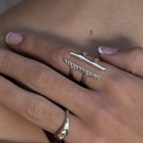 Hand wearing the Akash Shield Statement Ring in sterling silver.